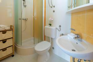 Kúpeľňa v ubytovaní Apartmani Dana