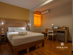 Cama o camas de una habitación en Hoteles Paraiso CHICLAYO