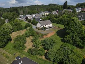 an aerial view of a house in a residential neighborhood at Villa de Mamoune in Martelange