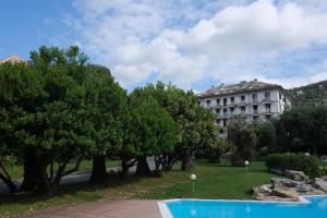 a building and trees in front of a building at Nervi, sea view in Genoa