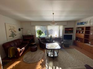 a living room with a couch and a table at Hiitolantie 4 in Härmä