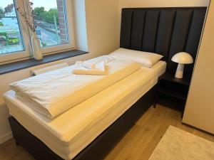 Postel nebo postele na pokoji v ubytování Urbanes Apartment Bielefeld-Bethel + 5 fotografií