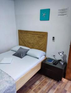 Cama ou camas em um quarto em Posada San Nicolas