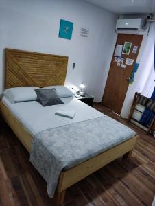 Cama ou camas em um quarto em Posada San Nicolas