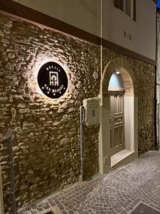 a stone wall with a door in a building at Relais San Biagio Lanciano in Lanciano