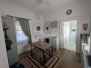 a small kitchen with a table and a counter at The Railway Sleeper in Cullybackey