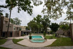 a swimming pool in the yard of a house at Complejo Turistico Open Club in Paraná