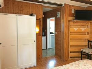 a bedroom with a bed and a closet and a tv at Apartments Novela in Poljanak