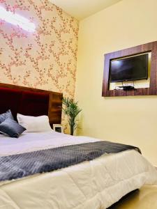 Voodi või voodid majutusasutuse Heaven hills resort Pushkar toas