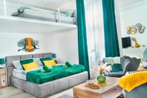 a living room with a bed and a couch at Cuddle Corner Budapest in Budapest