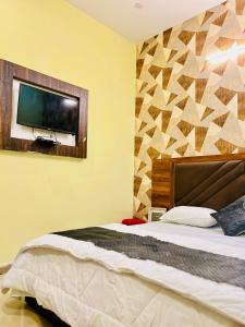 Voodi või voodid majutusasutuse Heaven hills resort Pushkar toas
