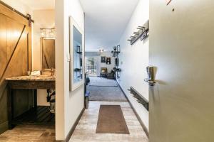 a hallway with a door and a hallway with a sink at 231 Bldg C condo in Truckee
