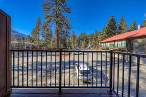 a gate with a car parked outside of a building at 231 Bldg C condo in Truckee +7 photos