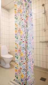 a shower curtain in a bathroom with a toilet at Morup Mølle Kro in Bedsted Thy