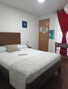 Cama ou camas em um quarto em Posada San Nicolas