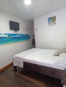 Cama ou camas em um quarto em Posada San Nicolas