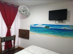 Uma TV ou centro de entretenimento em Posada San Nicolas