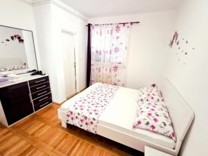 Postel nebo postele na pokoji v ubytování Apartment Eva
