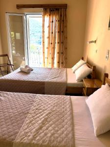 Postel nebo postele na pokoji v ubytování Peyko Rooms