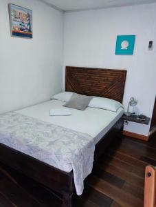 Cama ou camas em um quarto em Posada San Nicolas