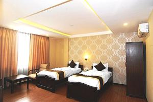 Voodi või voodid majutusasutuse Kathmandu Grand Hotel toas