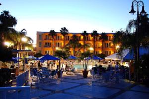 a group of people sitting in chairs near a pool at Safety Harbor Resort & Spa Trademark Collection by Wyndham in Safety Harbor