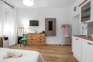 a bedroom with a bed and a sink and a dresser at Medulic in Šibenik