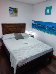 Cama ou camas em um quarto em Posada San Nicolas
