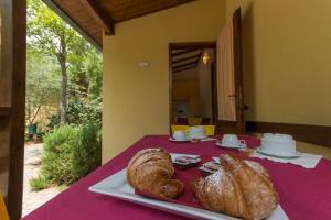 two loaves of bread are sitting on a table at Village Camping Hawaii in Albinia +19 photos