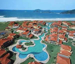 an aerial view of a resort with the water at Búzios Beach Resort in Búzios