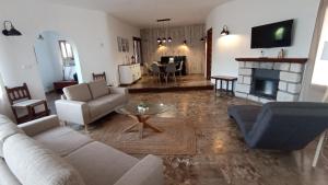 a living room with a couch and a fireplace at La Font Moraira in Moraira