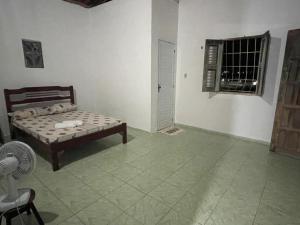 En eller flere senge i et værelse på Coqueiros Lounge + 8 billeder