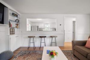 a living room with a couch and a table at Deeded Pond Access Ping Pong in Harwich +30 photos