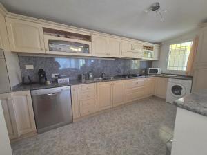 A kitchen or kitchenette at Villa Jone