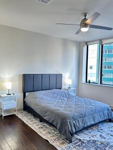 a bedroom with a large bed and two night stands at High-Rise Apartment in Downtown Dallas wPool in Dallas +38 photos
