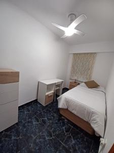 Ένα ή περισσότερα κρεβάτια σε δωμάτιο στο piso tres habitaciones +1 φωτογραφίες