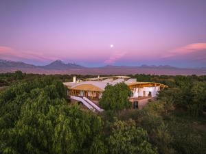 an aerial view of a house in the middle of trees at Explora en Atacama - All Inclusive in San Pedro de Atacama