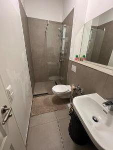 a bathroom with a toilet and a sink at To&To Apartments 1 Bedroom in Stuttgart