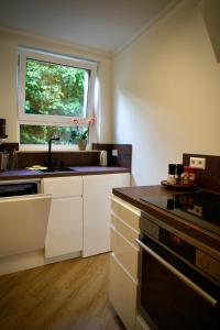 a small kitchen with a sink and a window at Apartment in Berlin-Köpenick in Berlin