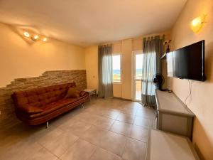 Μια τηλεόραση ή/και κέντρο ψυχαγωγίας στο Oceanside Apartment in El Medano