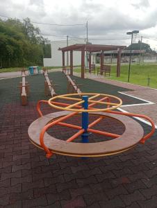 a playground with a hoses on it in a park at Porto Marina Residence in Ananindeua