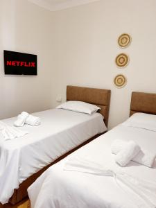 Postel nebo postele na pokoji v ubytování Villa Reve de Tirana