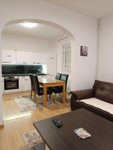a living room with a couch and a table at Villa Majida Ilidža in Sarajevo
