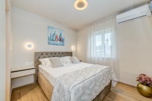 Ένα ή περισσότερα κρεβάτια σε δωμάτιο στο Beach Residence Parat