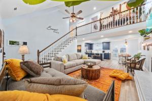 a living room with a couch and a table at Sunset Shack in Myrtle Beach