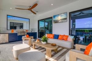 a living room with a couch and a table at Marco Luxe Retreat Waterfront in Marco Island