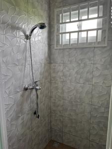 a bathroom with a shower with a glass door at Garnizoenspad appartementen in Baskamp +44 photos