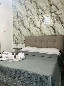 Ένα ή περισσότερα κρεβάτια σε δωμάτιο στο Shamà rooms