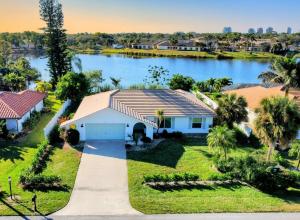 an aerial view of a house with a lake at Stunning Lakeside Retreat, heated Pool, renovated in Bonita Springs