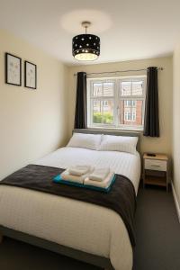 Ένα ή περισσότερα κρεβάτια σε δωμάτιο στο Elegant 2 Bed-Ground Floor